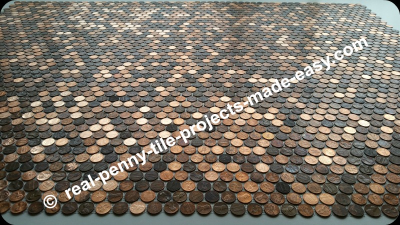 Dry fit of 12 real penny tile sheets made with (copper) coins/pennies.