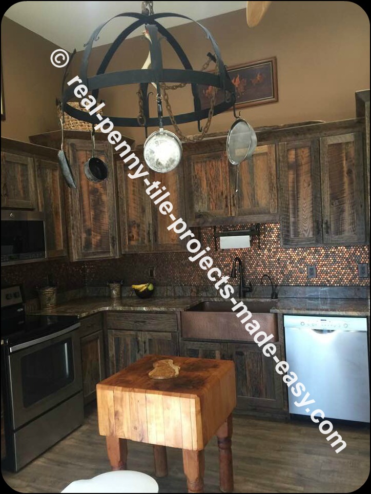 Rustic themed kitchen including backsplash made with real pennies installed as tile sheets and grouted.