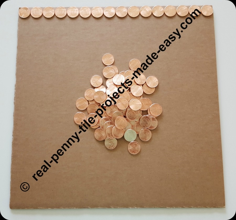 16 pennies fit on the side of a 12 inch cardboard.