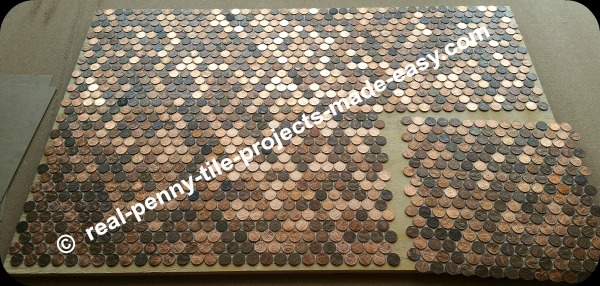Six sheets of pennies covering a floor.